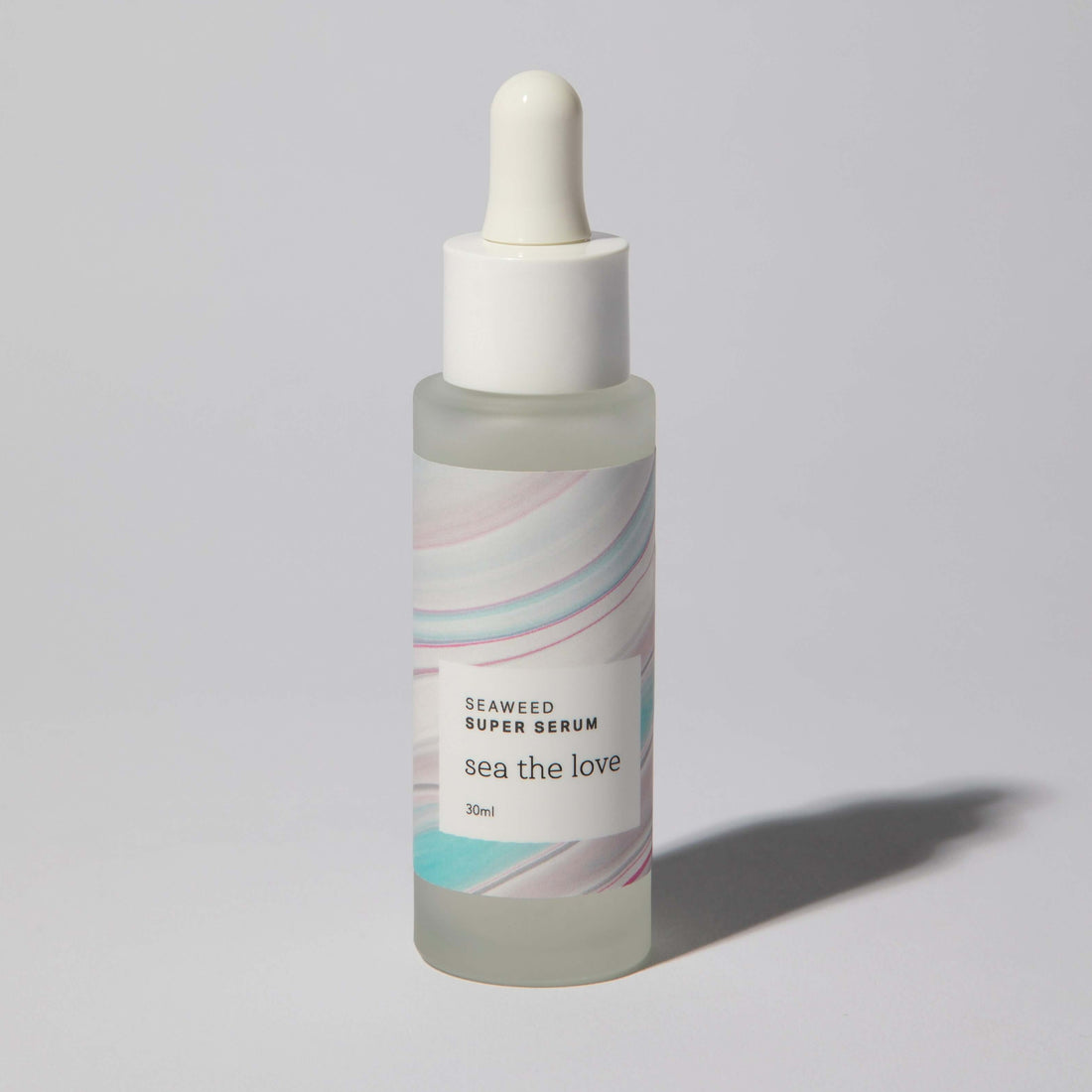 Seaweed Super Serum bottle, featuring natural ingredients: red seaweed, hyaluronic acid, and sea mineral extract.