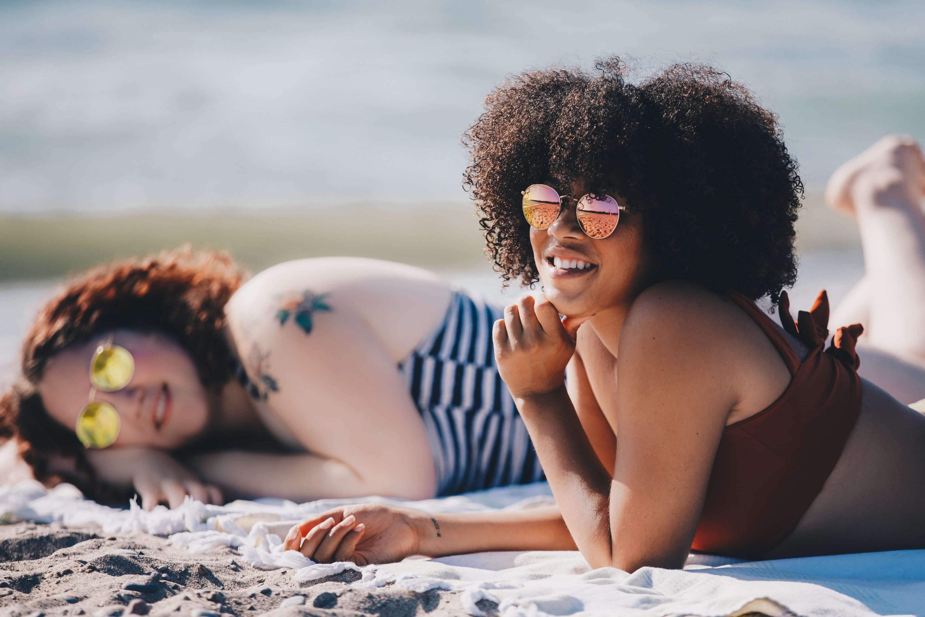 women relaxing on the beach