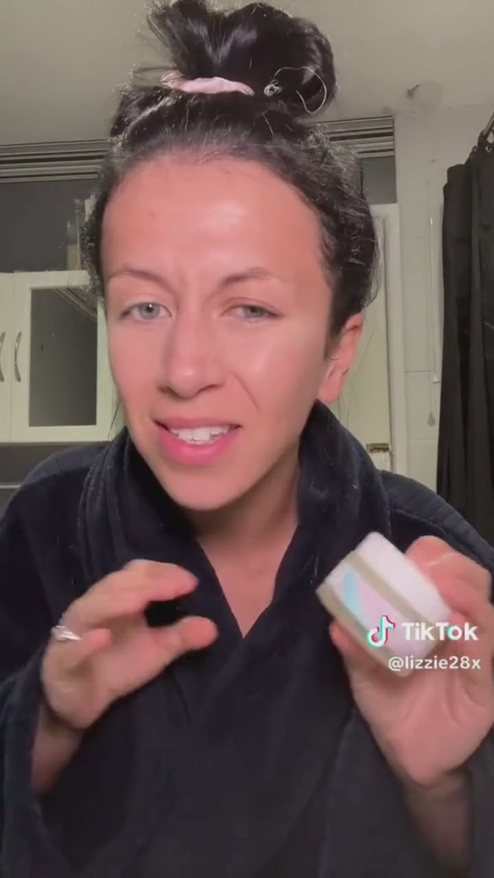 A video of a woman using Sea the Love's Beachy Clean Melting Cleanser